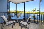 Screen enclosed Balcony overlooking lake & golf course.